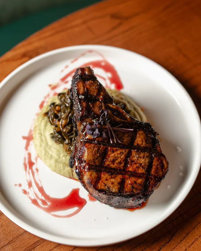 Grilled chop with a red sauce at Pearl & Horn